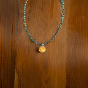 Blue/Gold beaded Necklace w Glass globe of Yellow Stars  20 inches